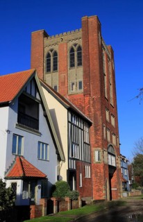 Eccentric mock Tudor architecture of water tower and houses, Thorpeness, Suffolk, England, UK