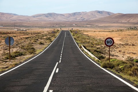 Straight tarmac road crossing desert, Fuerteventura, Canary Islands, Spain, Europe