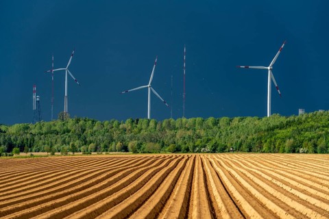 Wind turbines on the Grevenbroich wind test field, dark rain clouds, in the Rhenish lignite mining