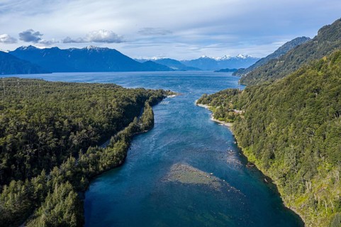 Western shore of lake Todos los Santos, river Rio Puertohue flowing into the lake, chilenean lake