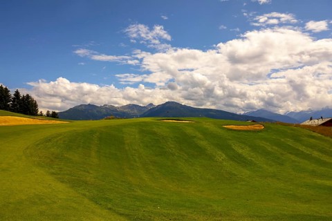 Crans Sur Sierre Golf Course with Hole 7 and Mountain View in Crans Montana in Valais, Switzerland,