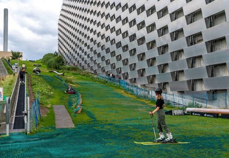 CopenHill, waste incineration plant and artificial ski slope, skiing with a view of the ski lift,
