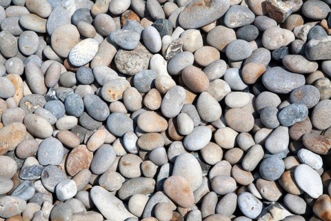 Close up rounded pebbles on shingle beach, Chesil Beach, Chiswell, Isle of Portland, Dorset,