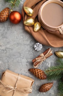 Christmas or New Year composition. Decorations, cones, cinnamon, fir and spruce branches, cup of