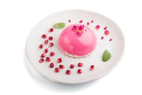Pink mousse cake with strawberry isolated on white background. top view