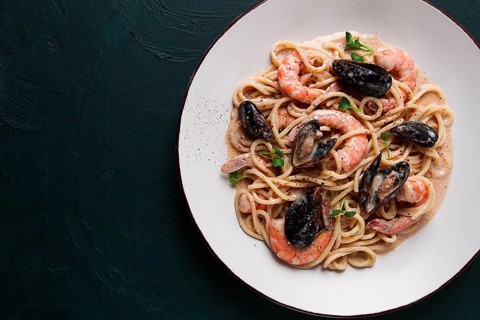 Spaghetti, pasta, with seafood, shrimp with mussels, in creamy garlic sauce, homemade, no people