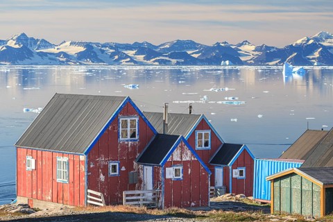 Typical Greenlandic house in an Inuit settlement on a fjord off Bergen, sunny, Ittoqqortoormiit,