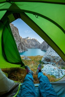 Wild camping, camping in the wilderness with a tent, Kol Suu mountain lake, Sary Beles Mountains,