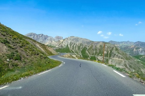 Mountain road from Col de la Bonette to Col de Raspaillon in high mountains above tree line, French