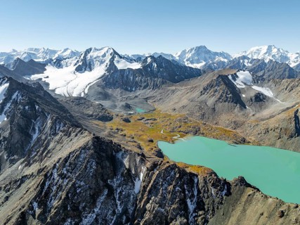 Mountain panorama, aerial view, 4000 metre peak with glacier, mountain pass and mountain lake