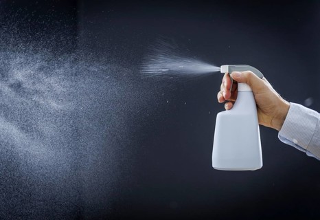 A man sprays a liquid into the air in Berlin, 09/08/2024