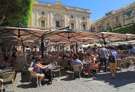 National Library building people at cafes in Republic Square, Valletta, Malta, Europe