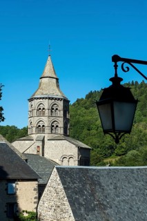 Orcival in Auvergne Volcanoes Regional Natural Park. Bell tower of the Notre-Dame d'Orcival