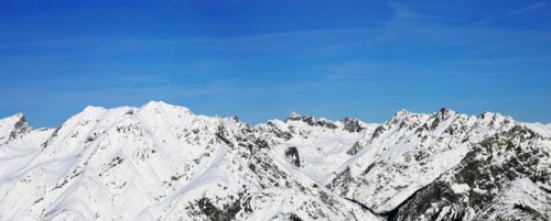 Alpine panorama with snow-covered mountain peaks in winter. Taken in the ski resort of Serfaus Fiss