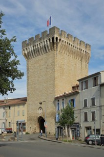 Porte d'Orange, city gate with battlements and French national flag, defence defence tower,