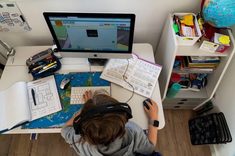 Young, primary school pupils, home learning, doing schoolwork, distance learning, virtual