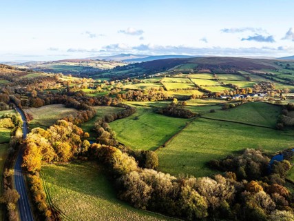Farms over Trecastle from a drone at sunset, Brecon Beacons National Park, Powys, Wales, England,