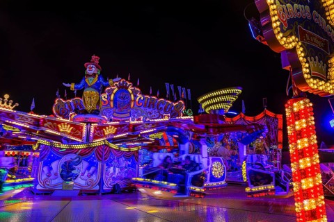 Illuminated round and elevated ride Circus Circus at standstill, night shot, Oktoberfest,