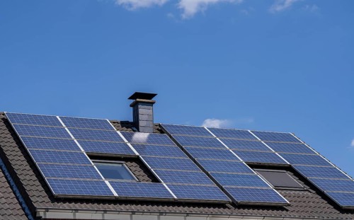 Solar system on the pitched roof of a residential building, photovoltaics for power generation, for