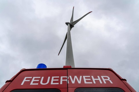 Height rescuers from the Oberhausen fire brigade practise abseiling from a wind turbine from a