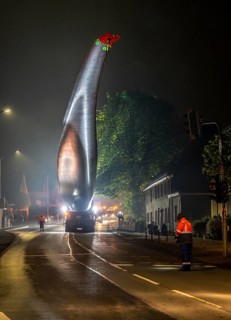 Transport of a 68 metre long, 22 tonne blade of a wind turbine, here in Breckerfeld, with a