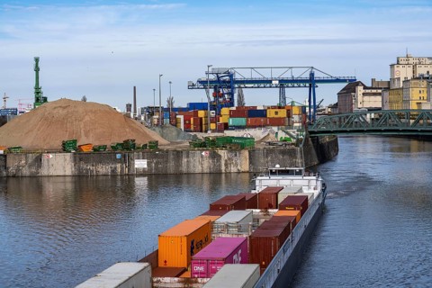 Container freighter Aarburg, leaving the container terminal in Frankfurt Osthafen, belonging to