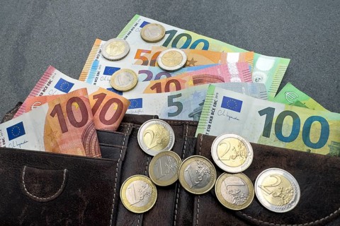 Symbol photo cash money banknotes euro banknotes coins coin money euro coins swells out of wallet