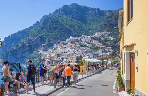 Footpath to the centre with panorama of the town on the steep slopes above the sea, Positano,