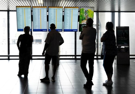 Info screens for departures, arrivals at Amsterdam Schiphol Airport, Terminal, Netherlands