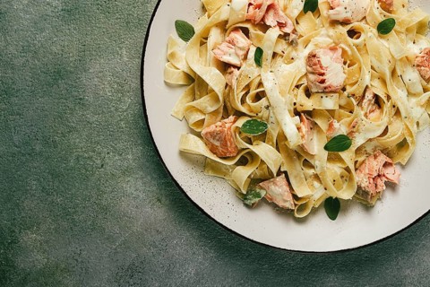 Tagliatelle pasta, in cream sauce with salmon, homemade, no people
