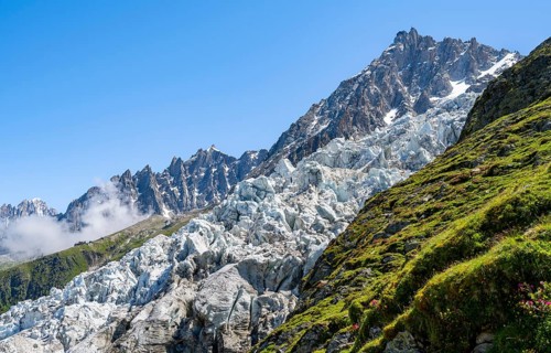 Glacier ice of the Glacier des Bossons with summit of the Aiguille du Midi, Chamonix, Haute-Savoie,