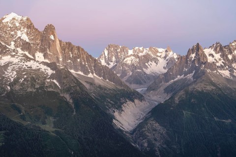 Evening mood with pink evening sky, mountain landscape at sunset, mountain peak Grandes Jorasses