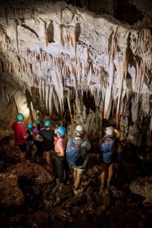 Visitors in a stalactite cave, tourists looking at stalactites in the Terciopelo Cave, Barra Honda