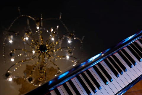 Crystal Lamp Reflected on a Piano in Switzerland