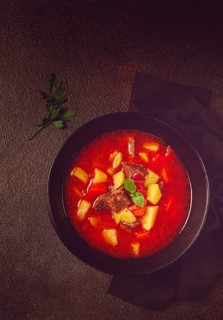 Meat goulash, with potatoes and carrots, sweet pepper, traditional Hungarian soup, homemade, no