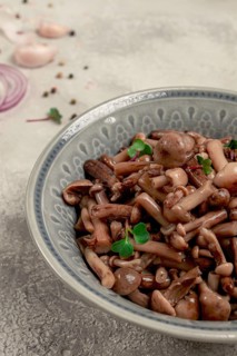 Pickled honey mushrooms, in a bowl, homemade, top view, no people