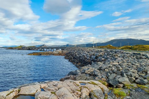 Bridge connecting rocky shores under a cloudy sky, autumn, Atlantic Road, Atlanterhavsveien,