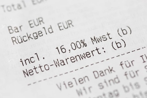 Close-up of a till receipt showing the reduction in VAT to sixteen per cent in Germany due to the