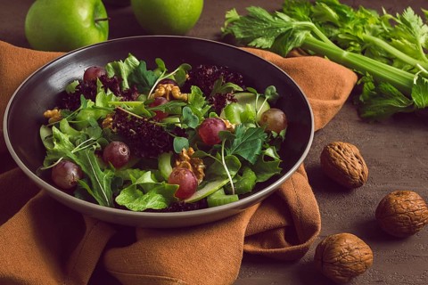Fresh, Waldorf salad, celery stalk with chicken, apple and walnut, grapes, herbs, homemade, no