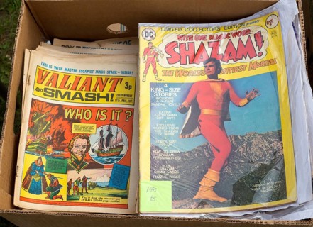 Close up of old comic magazines in box at car boot sale, Suffolk, England, UK