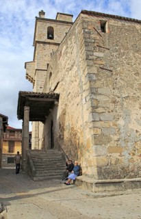 Old man and woman sitting by church in Garganta la Olla, La Vera, Extremadura, Spain, Europe
