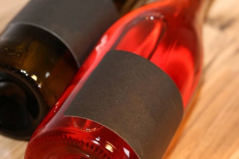 Close-up of two horizontal wine bottles