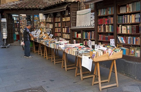 Books on display stalls outside book shop in Calle Mayor, Madrid city centre, Spain, Europe