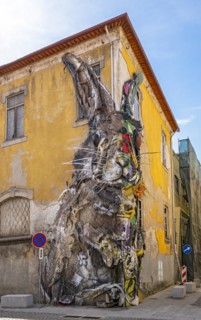 Half Rabbit, a piece of street art by Bordalo II in Vila Nova de Gaia, Porto, is a giant sculpture