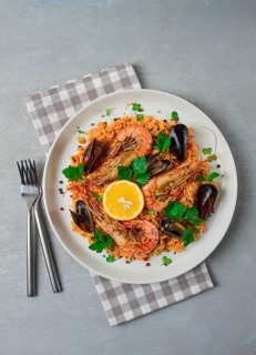 Seafood paella, shrimp and mussels risotto, rice, homemade, top view, no people