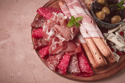 Appetizer, assortment, set, sausage, and cheese, on a wooden board, top view, no people