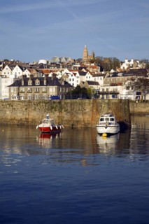 Boats in the harbour and the town of St Peter Port, Guernsey, Channel Islands, UK, Europe