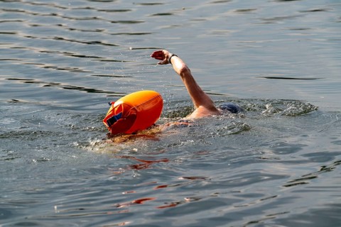 Open water swimmer, with marker buoy, in a lake, Wambachsee, 6-Seen-Platte, Duisburg, North