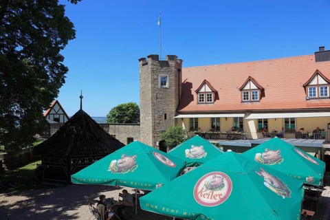 Sunshades of the beer garden on the castle ruins on the Schlossberg, Königsberg in Bavaria,
