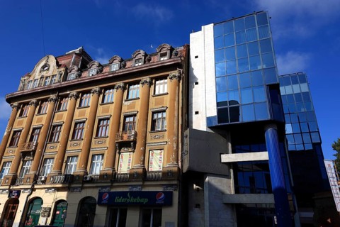 Houses, old building and modern building with glass facade, Romania, Banat, Timisoara, Timisoara,